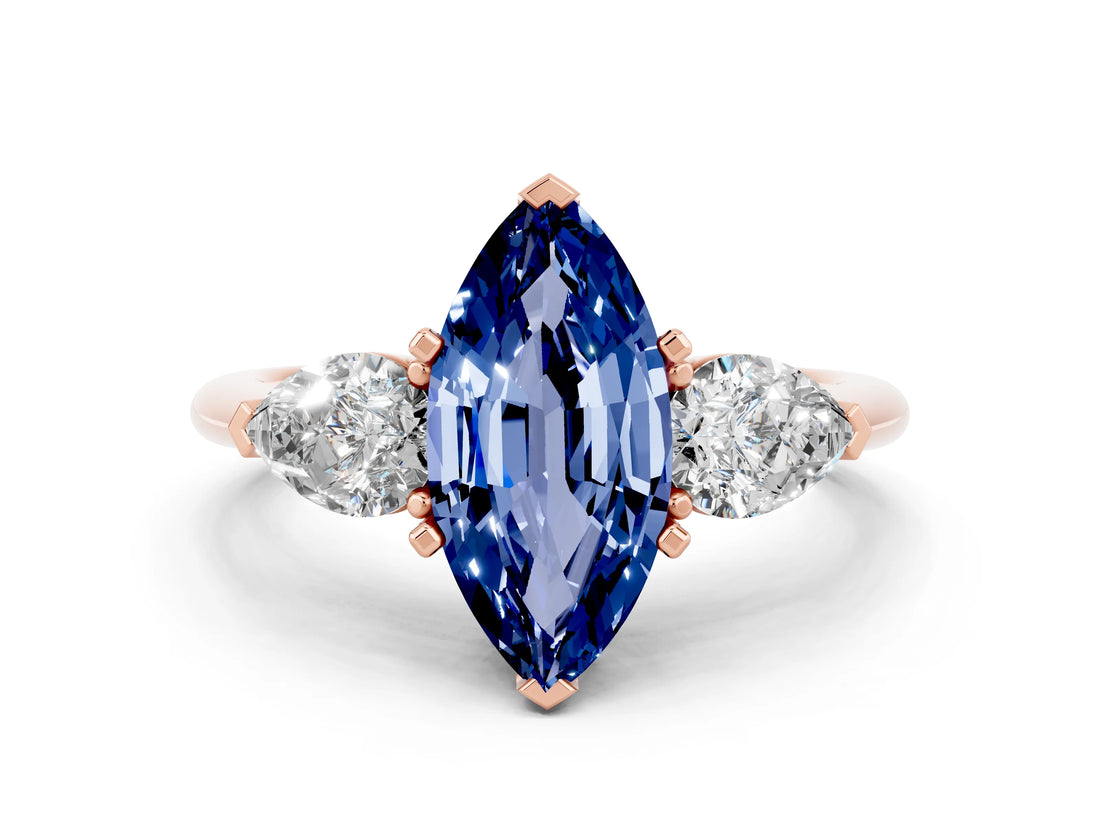 Rose gold Three-Stone Marquise Cut Blue Sapphire Ring with Pear Side Stones and Four-Prong Setting
