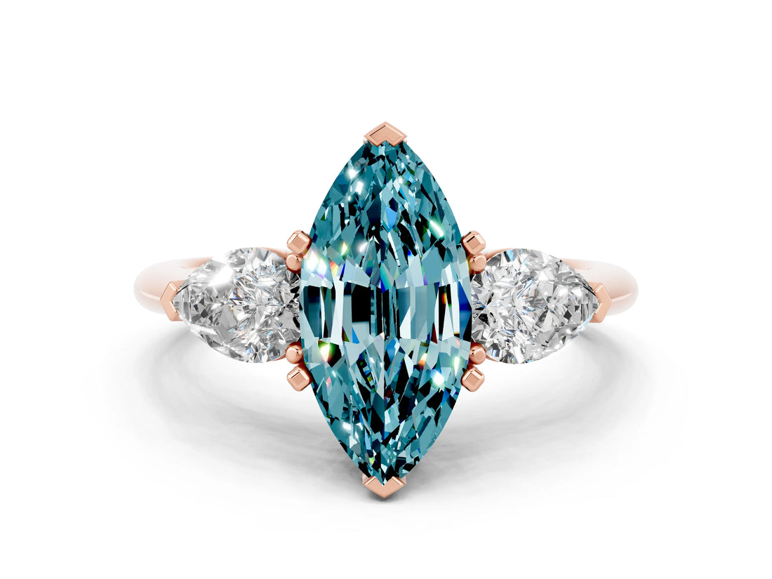 Rose gold Three-Stone Marquise Cut Blue Topaz Ring with Pear Side Stones and Four-Prong Setting