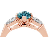Rose gold Three-Stone Marquise Cut Blue Topaz Ring with Pear Side Stones and Four-Prong Setting_4