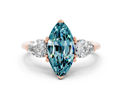 Rose gold Three-Stone Marquise Cut Blue Topaz Ring with Pear Side Stones and Four-Prong Setting