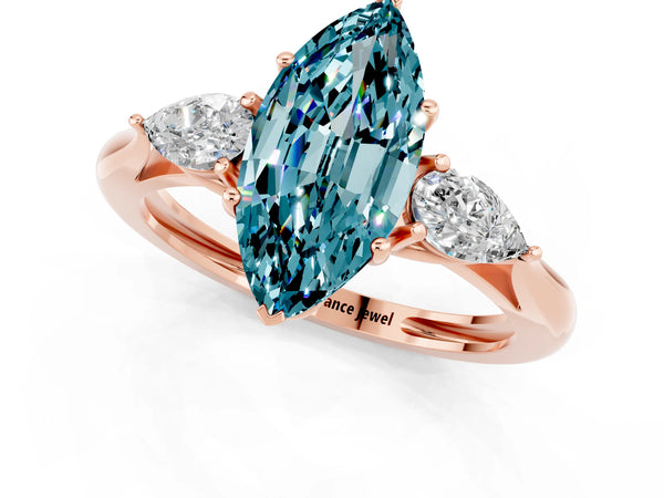 Rose gold Three-Stone Marquise Cut Blue Topaz Ring with Pear  Side Stones in Four-Prong Setting