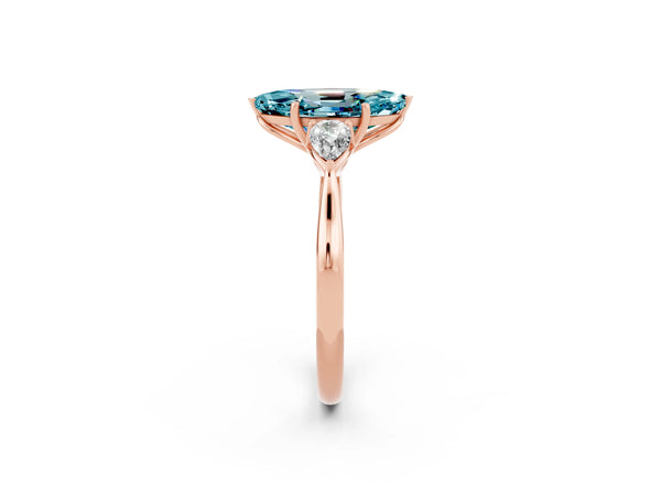 Rose gold Three-Stone Marquise Cut Blue Topaz Ring with Pear  Side Stones in Four-Prong Setting
