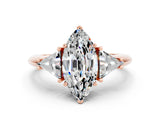 Rose gold Three-Stone Marquise Cut Cut Diamond Ring with Trillion Side Stones and Four-Prong Setting