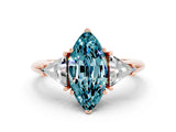 Rose gold Three-Stone Marquise Cut Cut Diamond Ring with Trillion Side Stones and Four-Prong Setting