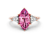 Rose gold Three-Stone Marquise Cut Cut Diamond Ring with Trillion Side Stones and Four-Prong Setting
