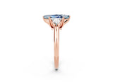 Rose gold Three-Stone Marquise Cut Cut Diamond Ring with Trillion Side Stones and Four-Prong Setting_25