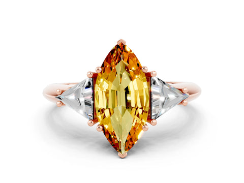 Rose gold Three-Stone Marquise Cut Cut Diamond Ring with Trillion Side Stones and Four-Prong Setting