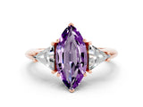 Rose gold Three-Stone Marquise Cut Cut Diamond Ring with Trillion Side Stones and Four-Prong Setting
