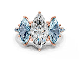 Rose gold Three-Stone Marquise Cut Diamond Ring with Round with Aquamarine side stone Pavé Band and Prong Setting