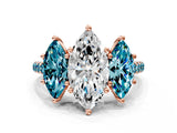 Rose gold Three-Stone Marquise Cut Diamond Ring with Round with Blue Topaz side stone Pavé Band and Prong Setting