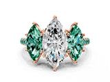 Rose gold Three-Stone Marquise Cut Diamond Ring with Round with Green Sapphire side stone Pavé Band and Prong Setting