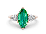 Rose gold Three-Stone Marquise Cut Emerald Ring with Pear Side Stones and Four-Prong Setting