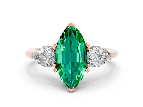 Rose gold Three-Stone Marquise Cut Emerald Ring with Pear Side Stones and Four-Prong Setting