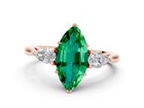 Rose gold Three-Stone Marquise Cut Emerald Ring with Pear  Side Stones in Four-Prong Setting_36