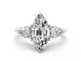 Rose gold Three-Stone Marquise Cut Moissanite Ring with Pear Side Stones and Four-Prong Setting