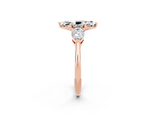 Rose gold Three-Stone Marquise Cut Moissanite Ring with Pear Side Stones and Four-Prong Setting
