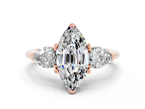 Rose gold Three-Stone Marquise Cut Moissanite Ring with Pear Side Stones and Four-Prong Setting