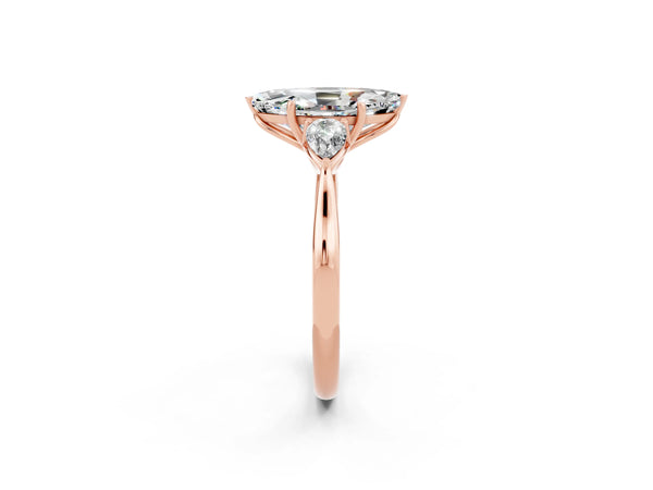 Rose gold Three-Stone Marquise Cut Moissanite Ring with Pear  Side Stones in Four-Prong Setting