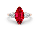 Rose gold Three-Stone Marquise Cut Ruby Ring with Pear Side Stones and Four-Prong Setting
