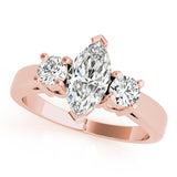 Rose gold Three-Stone Marquise Diamond Solitaire with Round Accents and Prong Setting on a Classic Band