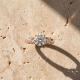 Rose gold Three-Stone Marquise Diamond Solitaire with Round Accents and Prong Setting on a Classic Band_9