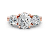 Rose gold Three-Stone Oval Brilliant Cut Solitaire Ring with Prong Setting on a Classic Band