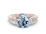 Rose gold Three-Stone Oval Cut Aquamarine Ring with Pear Side Stones and Four-Prong Setting