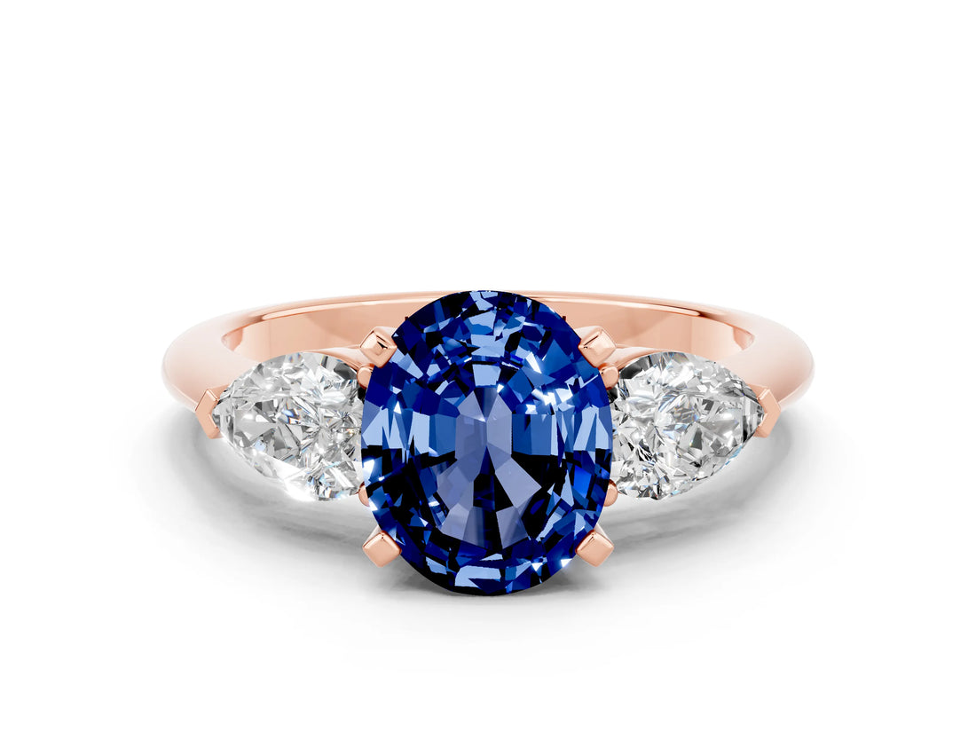 Rose gold Three-Stone Oval Cut Blue Sapphire Ring with Pear Side Stones and Four-Prong Setting