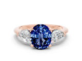 Rose gold Three-Stone Oval Cut Blue Sapphire Ring with Pear Side Stones and Four-Prong Setting