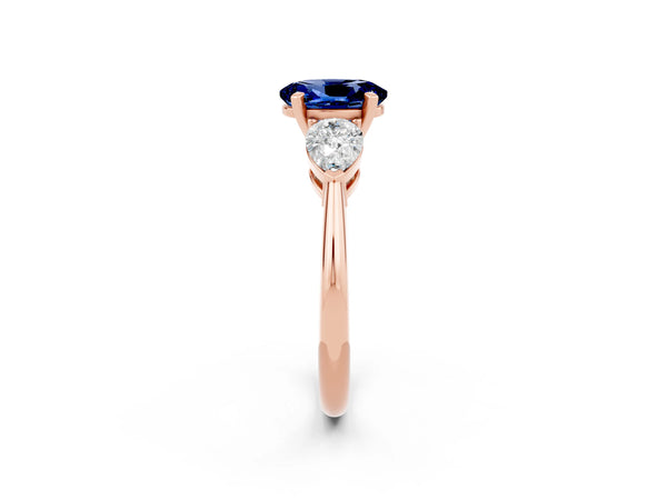 Rose gold Three-Stone Oval Cut Blue Sapphire Ring with Pear Side Stones and Four-Prong Setting