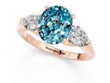 Rose gold Three-Stone Oval Cut Blue Topaz Ring with Pear Side Stones and Four-Prong Setting_1