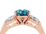 Rose gold Three-Stone Oval Cut Blue Topaz Ring with Pear Side Stones and Four-Prong Setting_4