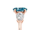 Rose gold Three-Stone Oval Cut Blue Topaz Ring with Pear Side Stones and Four-Prong Setting_5