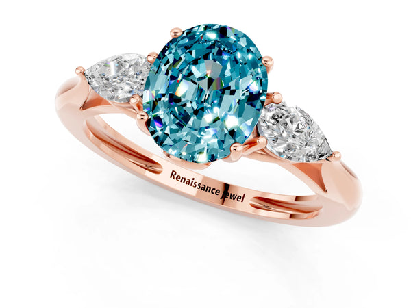 Rose gold Three-Stone Oval Cut Blue Topaz Ring with Pear  Side Stones in Four-Prong Setting