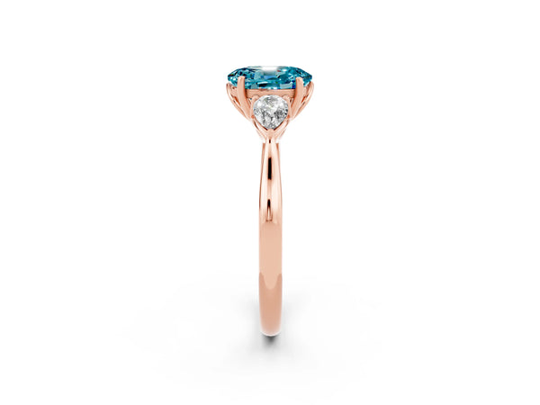 Rose gold Three-Stone Oval Cut Blue Topaz Ring with Pear  Side Stones in Four-Prong Setting
