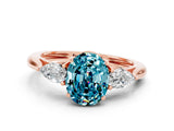 Rose gold Three-Stone Oval Cut Blue Topaz Ring with Pear  Side Stones in Four-Prong Setting_36