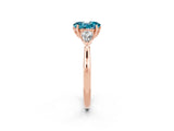 Rose gold Three-Stone Oval Cut Blue Topaz Ring with Pear  Side Stones in Four-Prong Setting_38