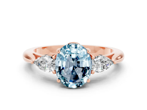 Rose gold Three-Stone Oval Cut Cut Diamond Ring with Pear Side Stones in Four-Prong Setting