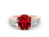 Rose gold Three-Stone Oval Cut Cut Diamond Ring with Trillion Side Stones and Four-Prong Setting