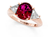 Rose gold Three-Stone Oval Cut Cut Diamond Ring with Trillion Side Stones and Four-Prong Setting_1