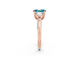 Rose gold Three-Stone Oval Cut Cut Diamond Ring with Trillion Side Stones and Four-Prong Setting_2
