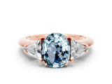 Rose gold Three-Stone Oval Cut Cut Diamond Ring with Trillion Side Stones and Four-Prong Setting
