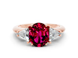 Rose gold Three-Stone Oval Cut Cut Diamond Ring with Trillion Side Stones and Four-Prong Setting