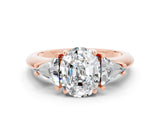 Rose gold Three-Stone Oval Cut Cut Diamond Ring with Trillion Side Stones and Four-Prong Setting