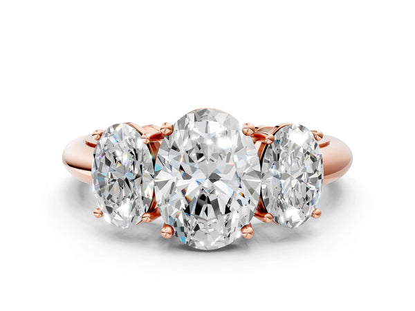 Rose gold Three-Stone Oval Cut Diamond Engagement Ring with Prong Setting on a White Gold Band