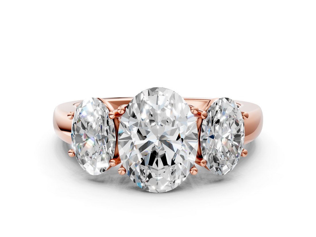 Rose gold Three-Stone Oval Cut Diamond Ring with Channel-Set Band and Four-Prong Setting_49