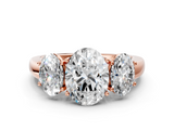 Rose gold Three-Stone Oval Cut Diamond Ring with Channel-Set Band and Four-Prong Setting_49