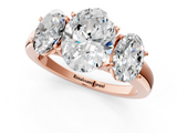 Rose gold Three-Stone Oval Cut Diamond Ring with Channel-Set Band and Four-Prong Setting_50