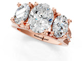 Rose gold Three-Stone Oval Cut Diamond Ring with Channel-Set Band and Four-Prong Setting_53
