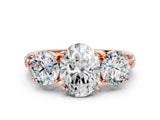 Rose gold Three-Stone Oval Cut Diamond Ring with Channel-Set Band and Prong Setting_6